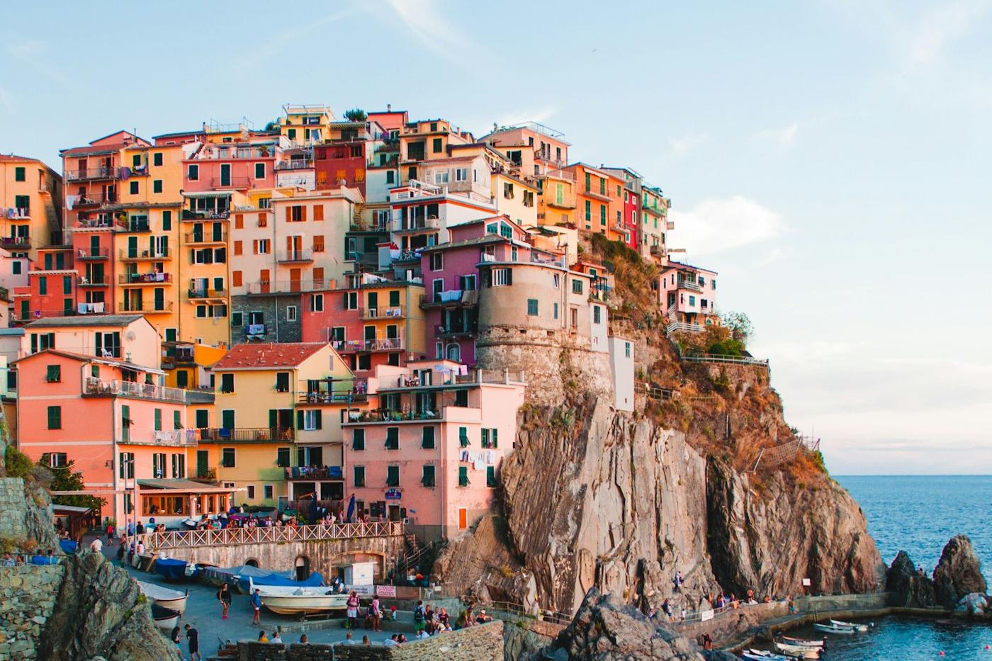 Colourful cliffside houses of a Cinque Terre village stacked above the sea on the Italian coast